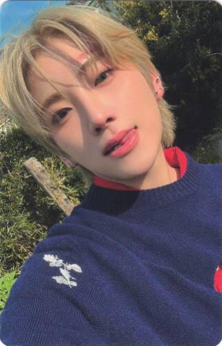 Photocard of Yuma sticking his tongue out