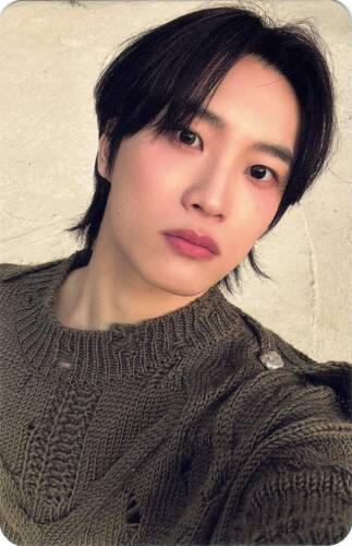 Photocard of Sunghyun staring at the camera in a sweater