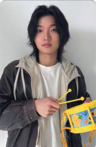 Photocard of Ganghun playing a toy drumset
